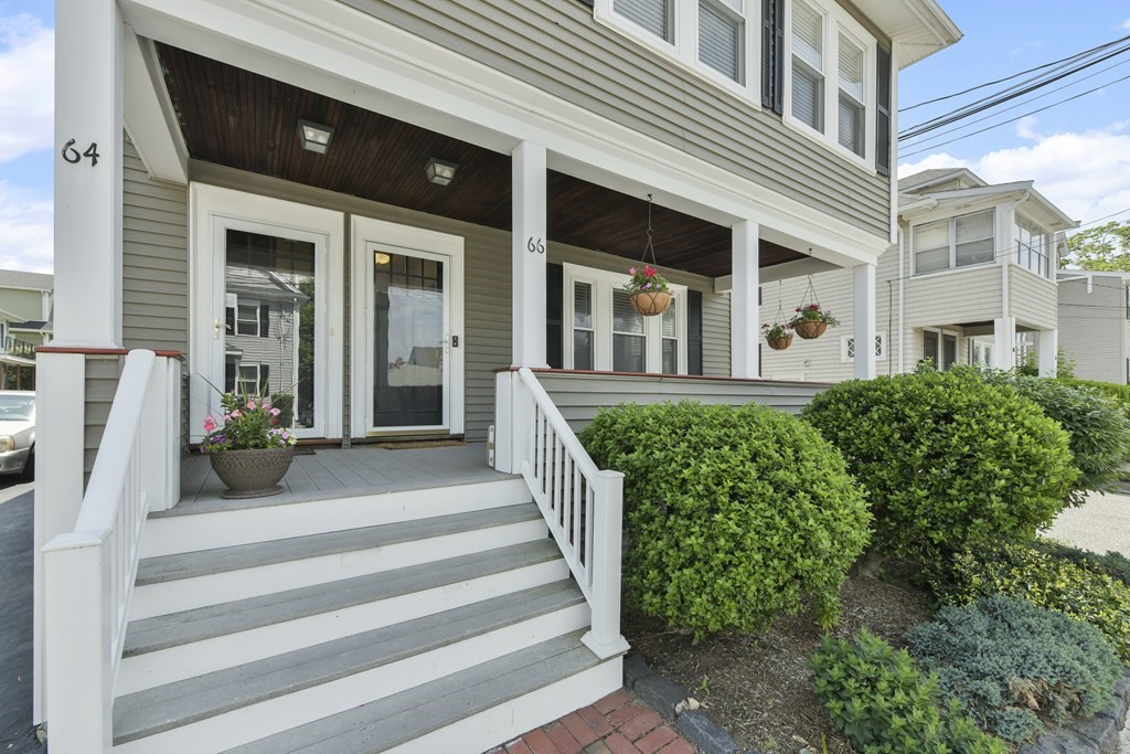64 Parmenter Road, Unit 1 Waltham, MA 02453 - Photo 25 of 25 a front view of a house with a garden