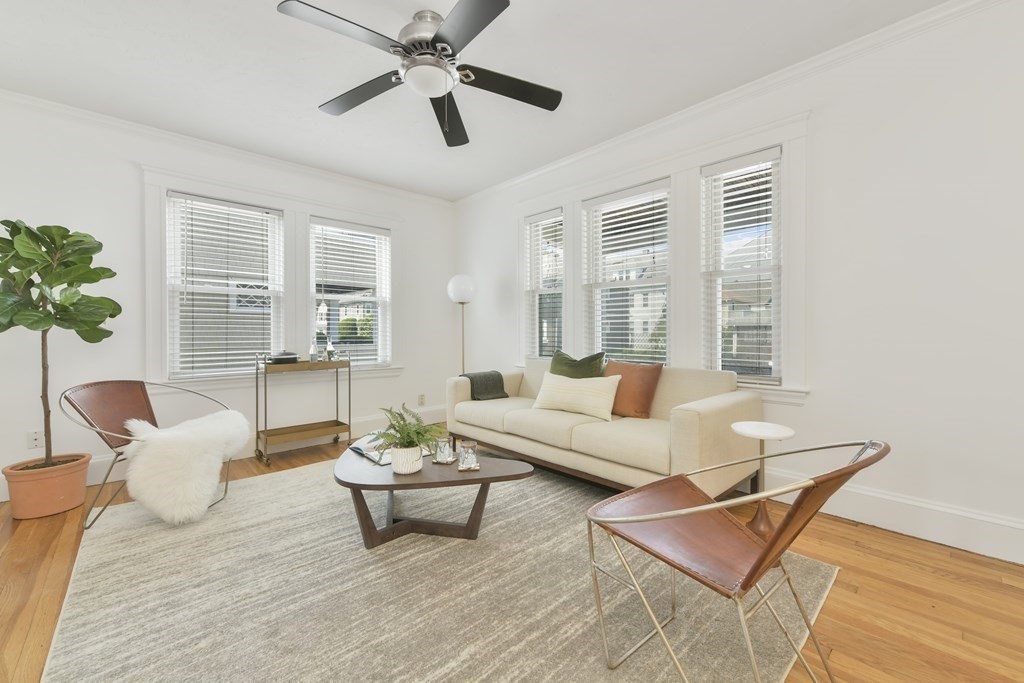 64 Parmenter Road, Unit 1 Waltham, MA 02453 - Photo 3 of 25 a living room with furniture and a large window