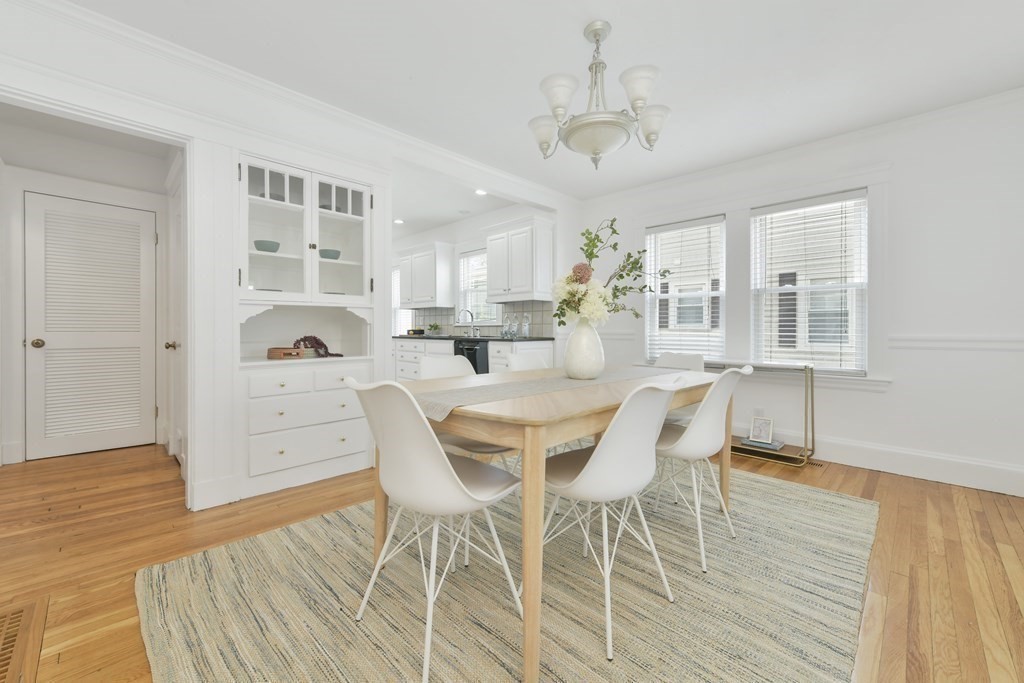 64 Parmenter Road, Unit 1 Waltham, MA 02453 - Photo 6 of 25 a dining room with wooden floor and breakfast area