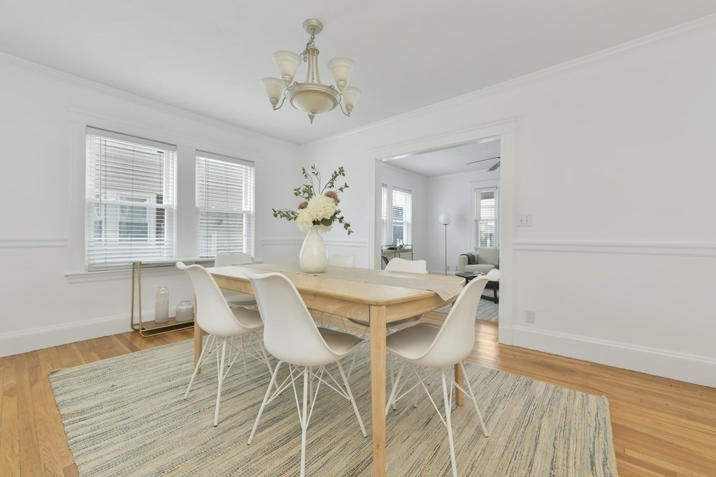 64 Parmenter Road, Unit 1 Waltham, MA 02453 - Photo 8 of 25 a view of a dining room with furniture window and wooden floor