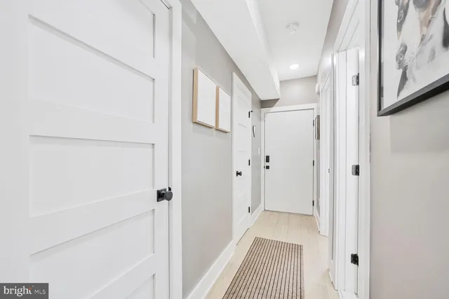 a view of a hallway with a white walls