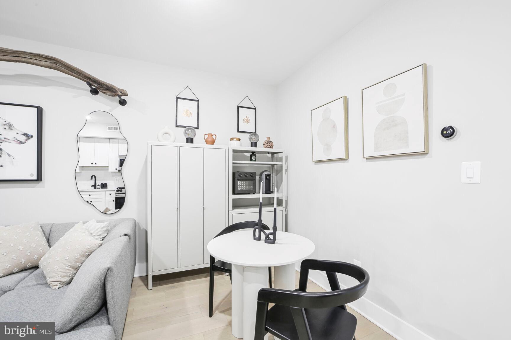 1144 Owen Place Northeast, Unit 1 Washington, DC 20002 - Photo 19 of 27 a view of a livingroom with furniture and window