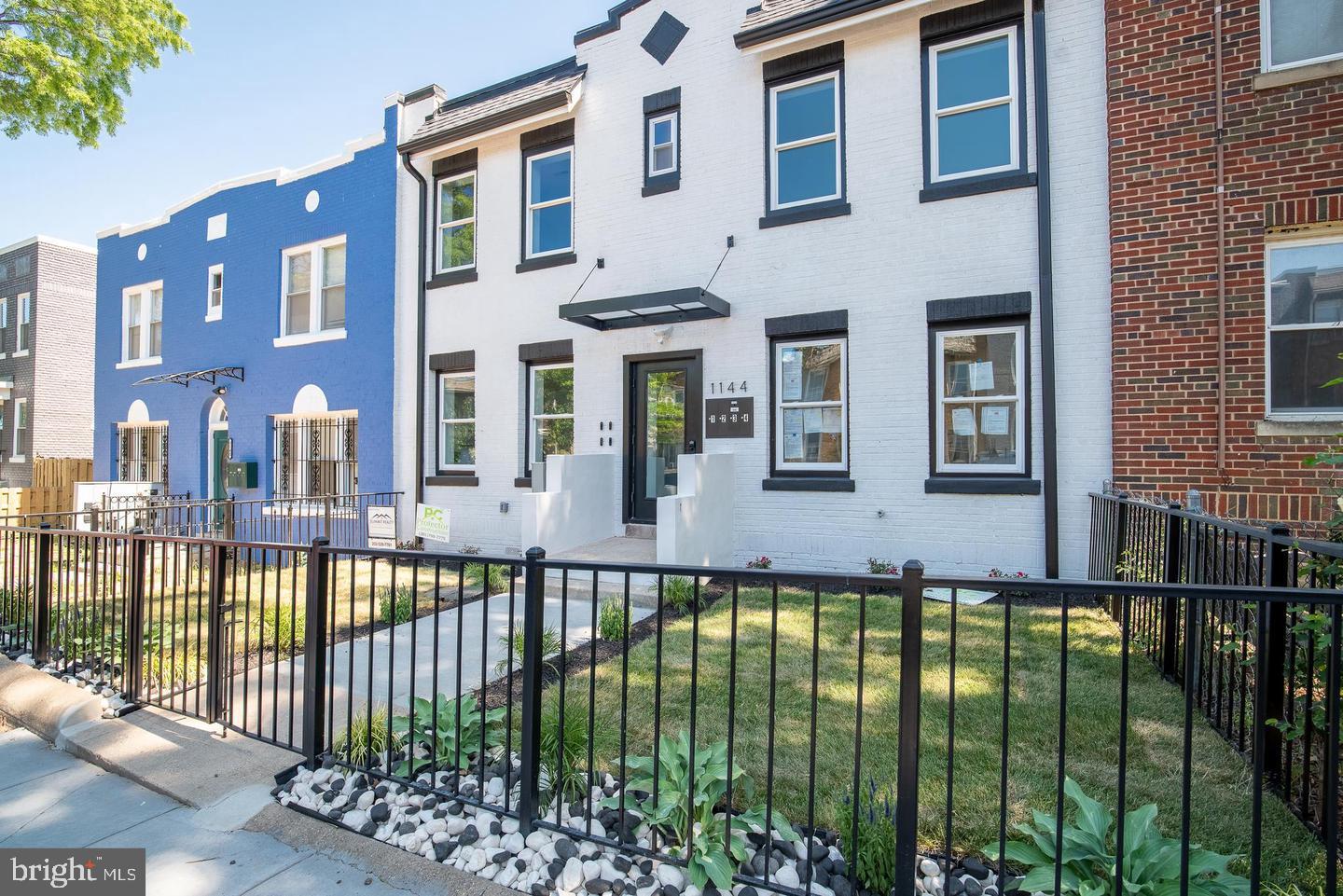 1144 Owen Place Northeast, Unit 1 Washington, DC 20002 - Photo 2 of 27 a view of a house with a swimming pool