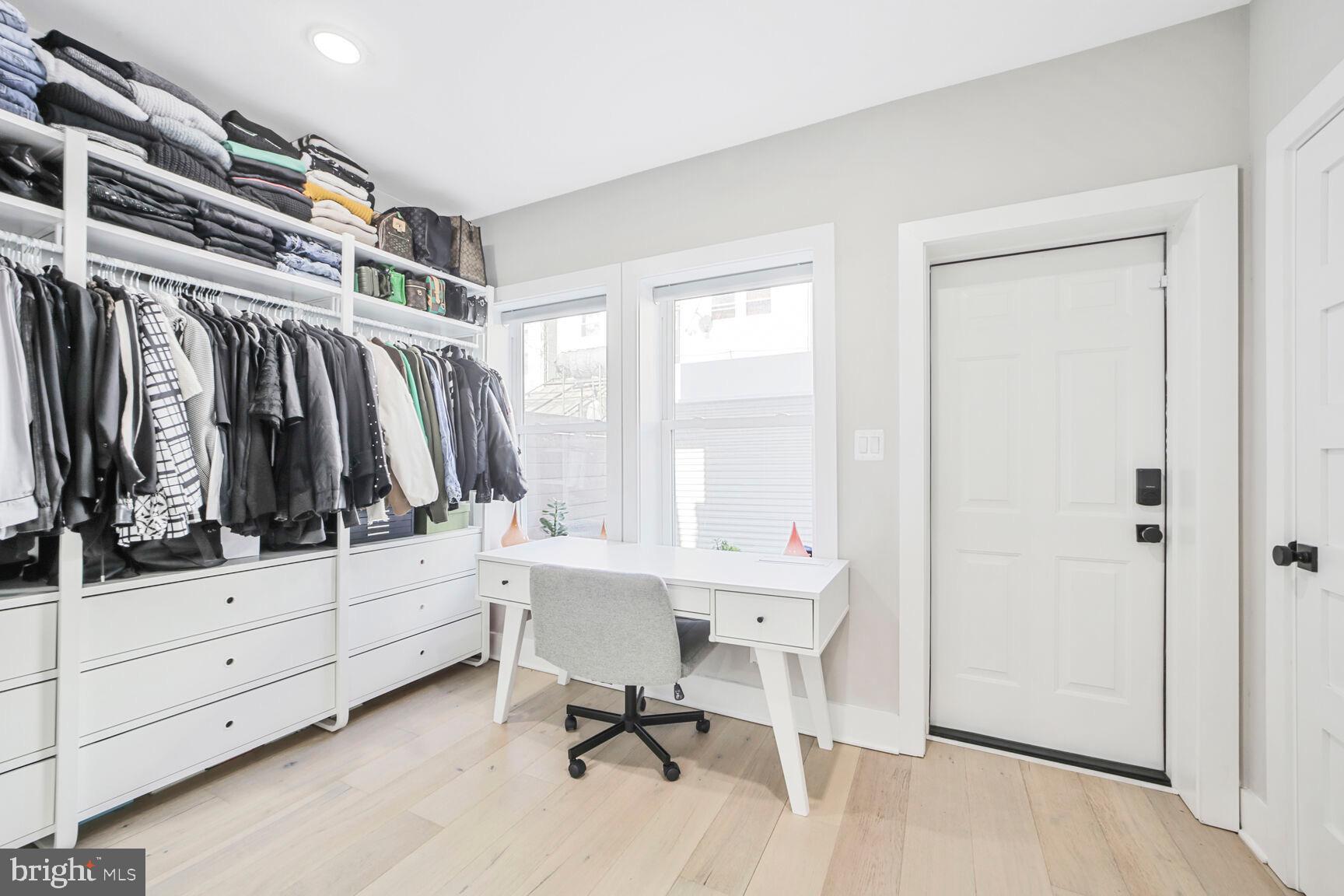 1144 Owen Place Northeast, Unit 1 Washington, DC 20002 - Photo 21 of 27 a view of walk in closet with clothes and shoes