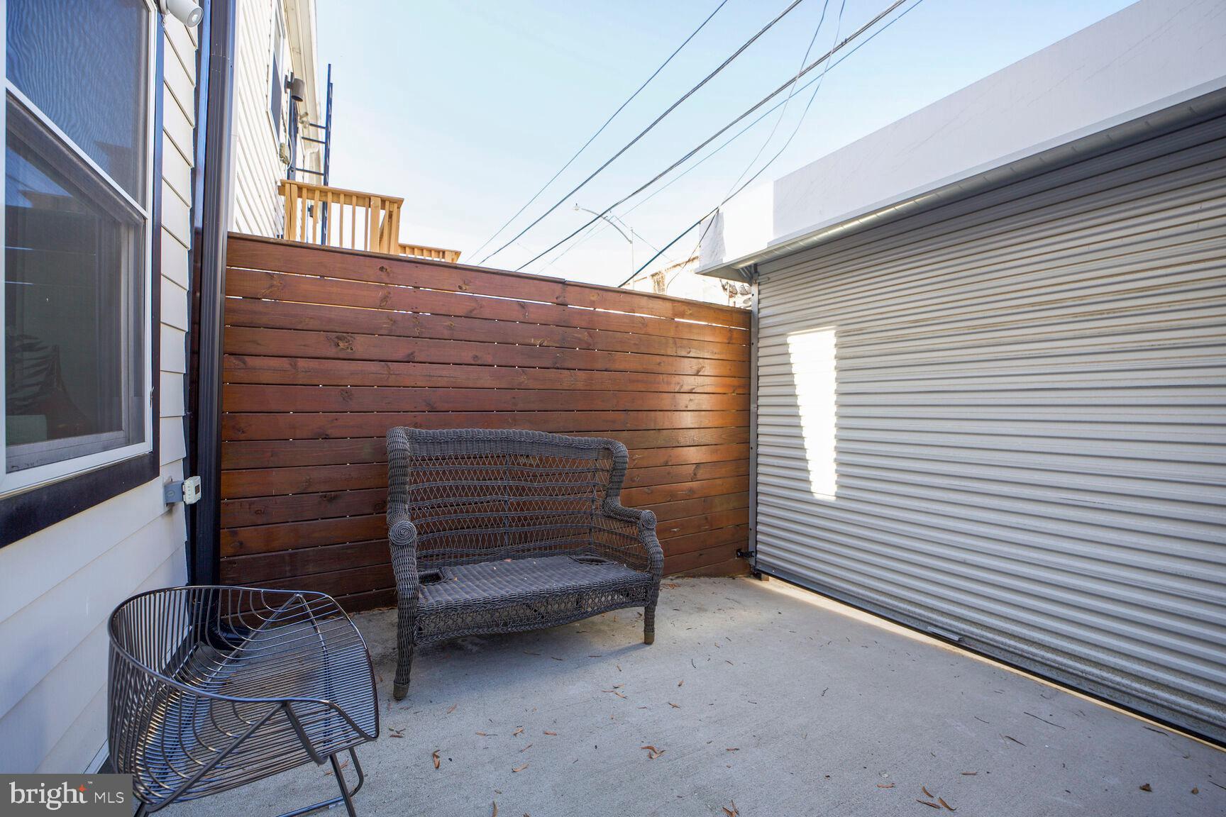 1144 Owen Place Northeast, Unit 1 Washington, DC 20002 - Photo 24 of 27 a view of wooden bench in porch