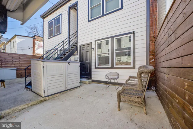 a view of a house with a bench