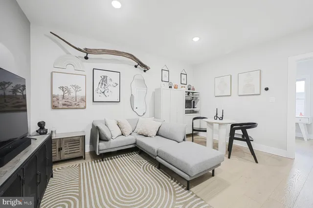 a living room with furniture and a rug