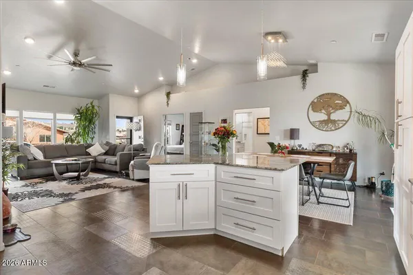 a living room with furniture and a clock