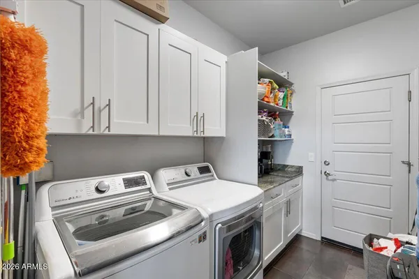 a utility room with dryer and washer