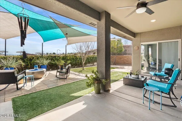 a building outdoor space with patio furniture and potted plants