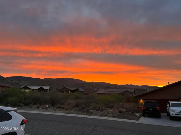 a view of a mountain with sunset view