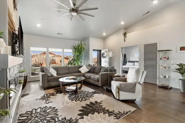a living room with furniture and a flat screen tv