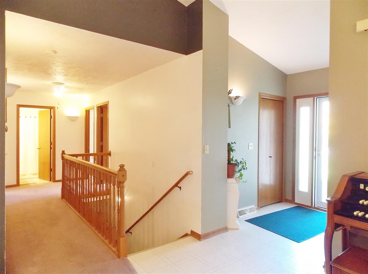 478 Marstonmoor Road Davis, IL 61019 - Photo 8 of 25 a view of a bedroom with wooden floor and windows