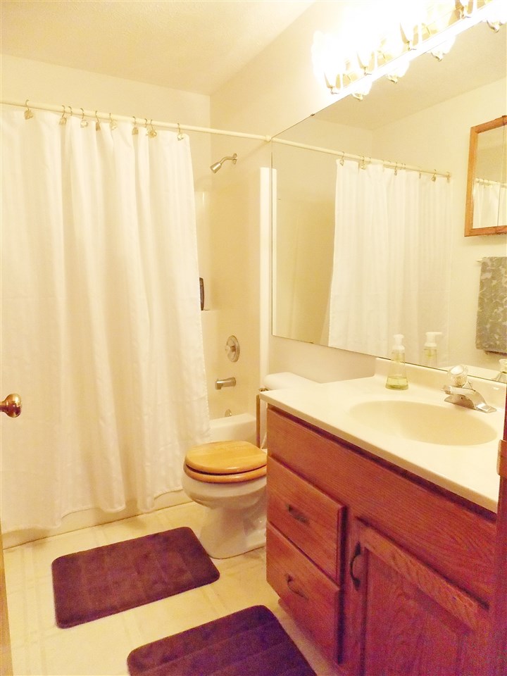 478 Marstonmoor Road Davis, IL 61019 - Photo 10 of 25 a bathroom with a granite countertop sink and a mirror