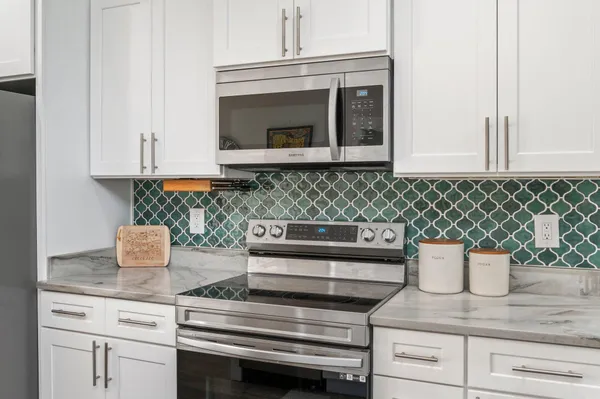 a kitchen with a sink and a stove