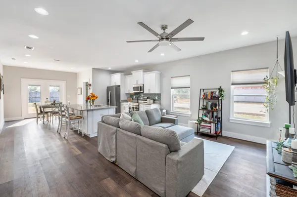 a living room with furniture and a large window