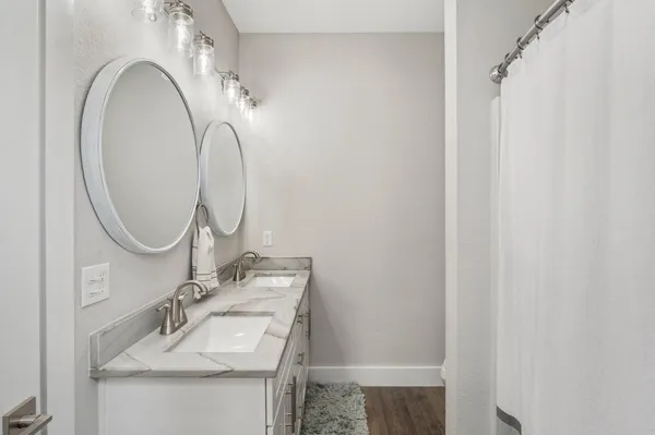 a bathroom with a sink and a mirror