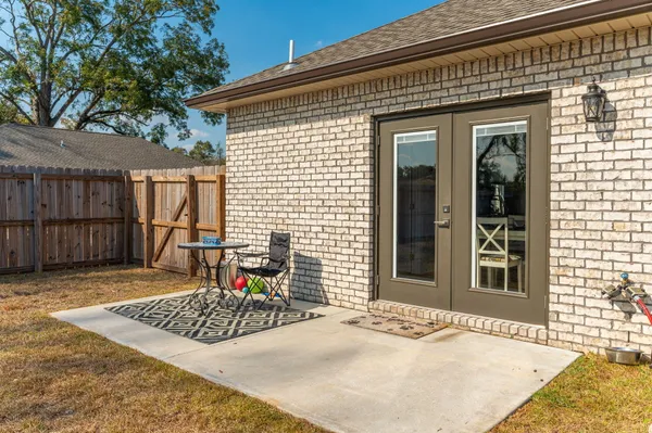 a view of a chairs and table in the patio