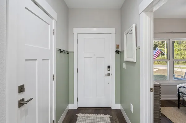 a view of bedroom with a bed and glass door