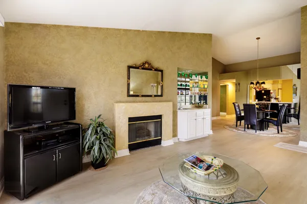 a view of a dining room with furniture and chandelier