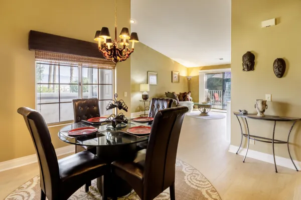 a dining room with furniture and window
