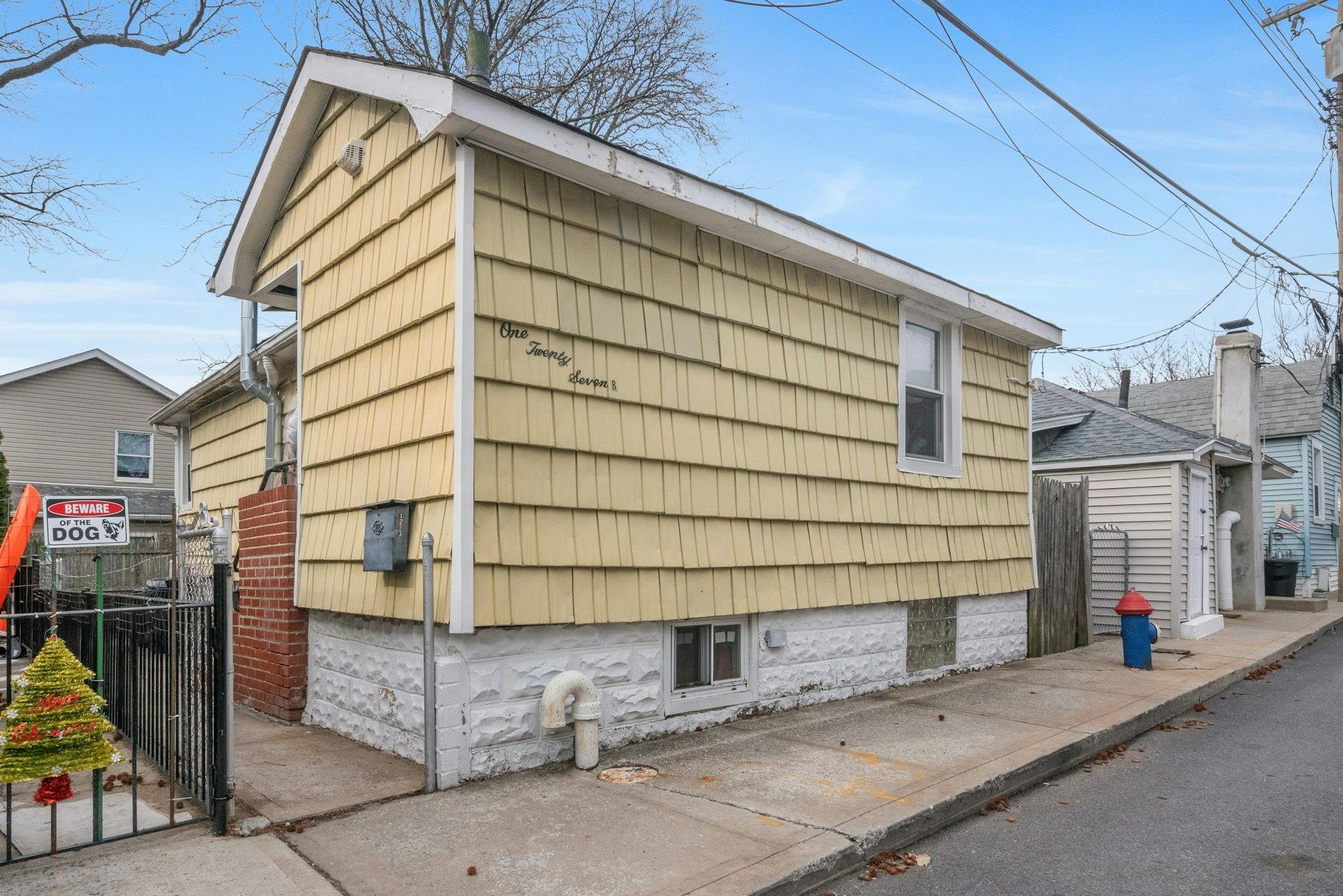 127 B Edgewater Park, Unit B Bronx, NY 10465 - Photo 1 of 26 a view of a street with wooden fence