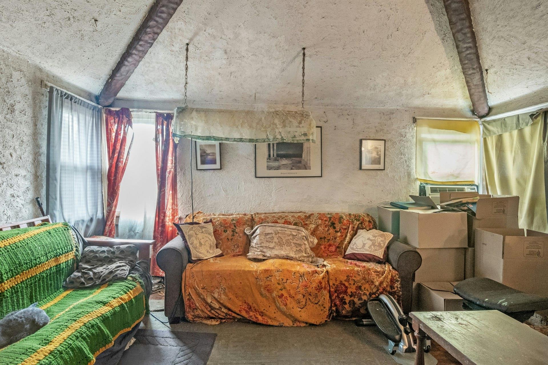 127 B Edgewater Park, Unit B Bronx, NY 10465 - Photo 5 of 26 a living room with furniture and a chandelier