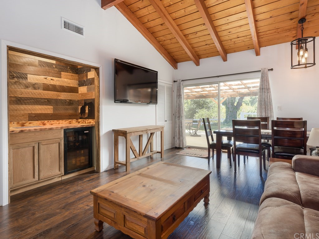 64 Ranchview Road Rolling Hills Estates, CA 90274 - Photo 14 of 38 a living room with furniture a flat screen tv and kitchen view