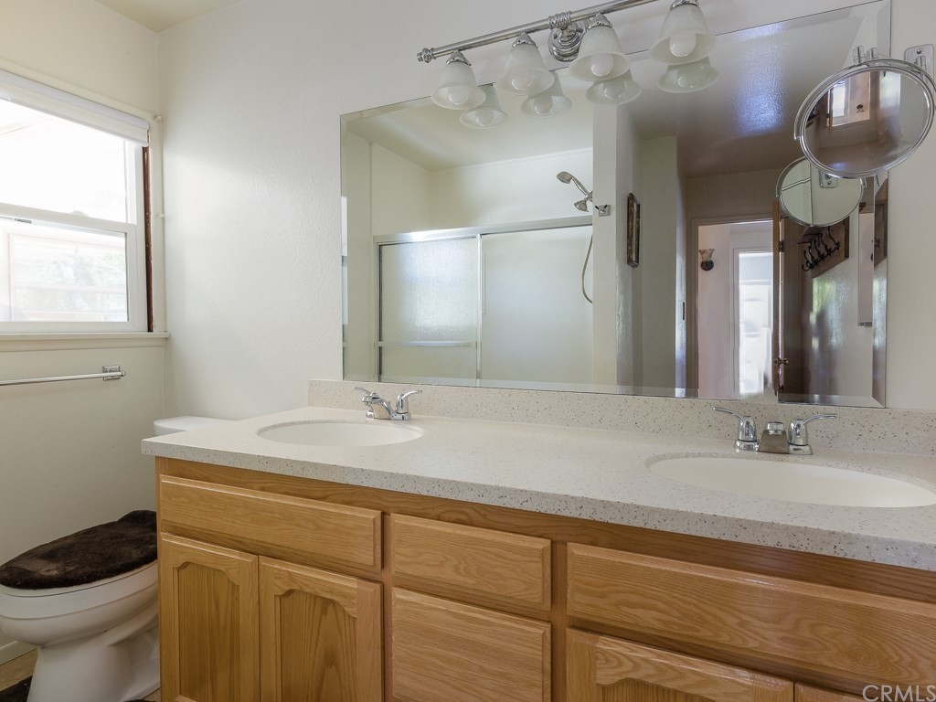 64 Ranchview Road Rolling Hills Estates, CA 90274 - Photo 20 of 38 a bathroom with a sink a toilet and a mirror