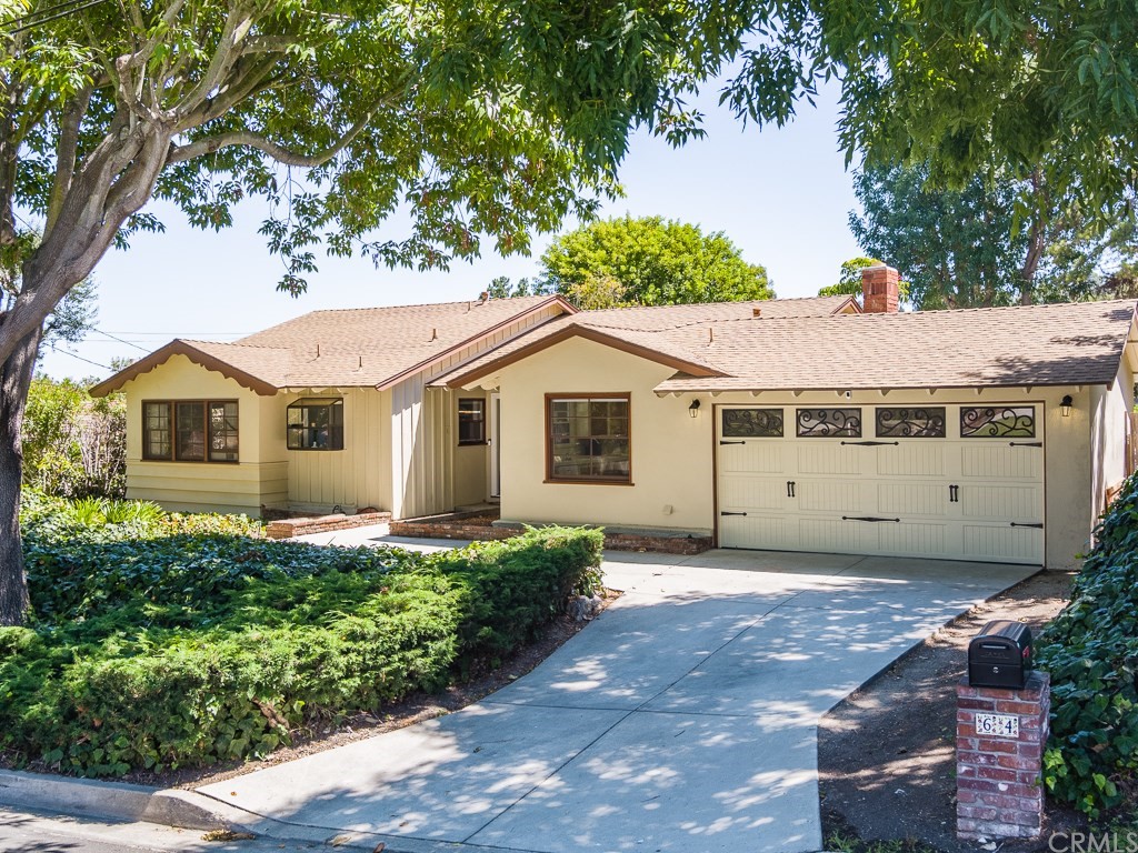 64 Ranchview Road Rolling Hills Estates, CA 90274 - Photo 2 of 38 a view of a white house next to a yard with potted plants and large trees