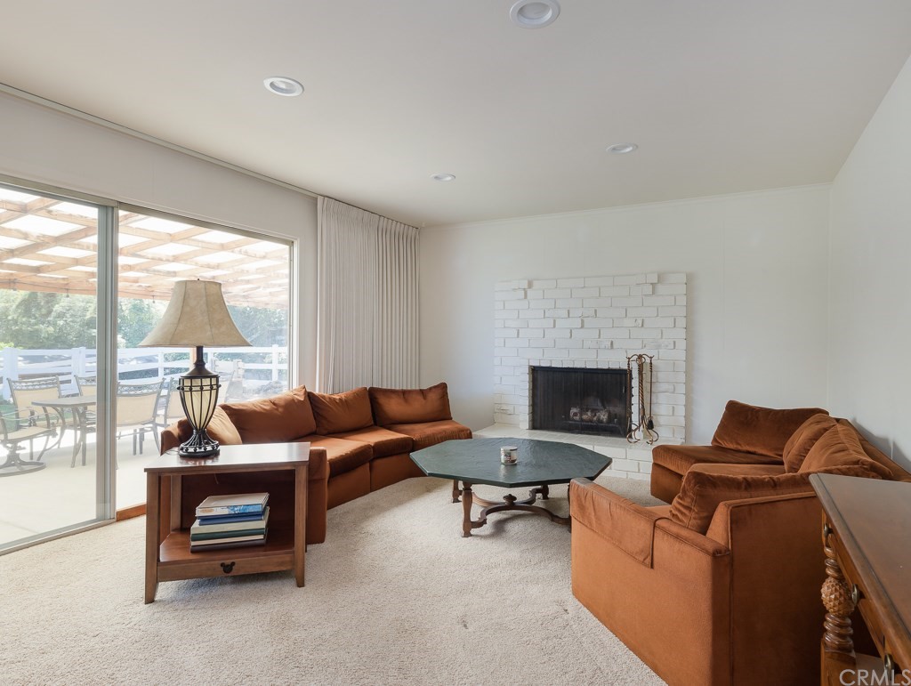 64 Ranchview Road Rolling Hills Estates, CA 90274 - Photo 4 of 38 a living room with furniture and a fireplace