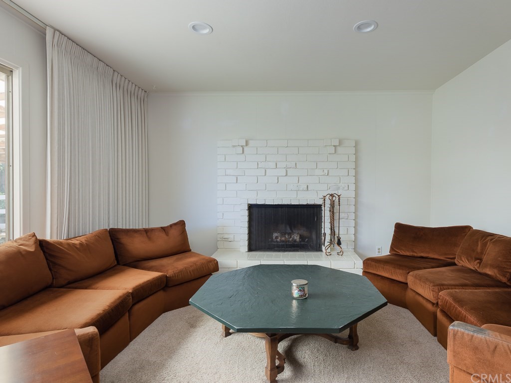 64 Ranchview Road Rolling Hills Estates, CA 90274 - Photo 5 of 38 a living room with furniture and a fireplace