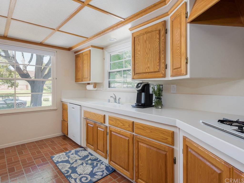 64 Ranchview Road Rolling Hills Estates, CA 90274 - Photo 10 of 38 a kitchen with stainless steel appliances cabinets window and a sink