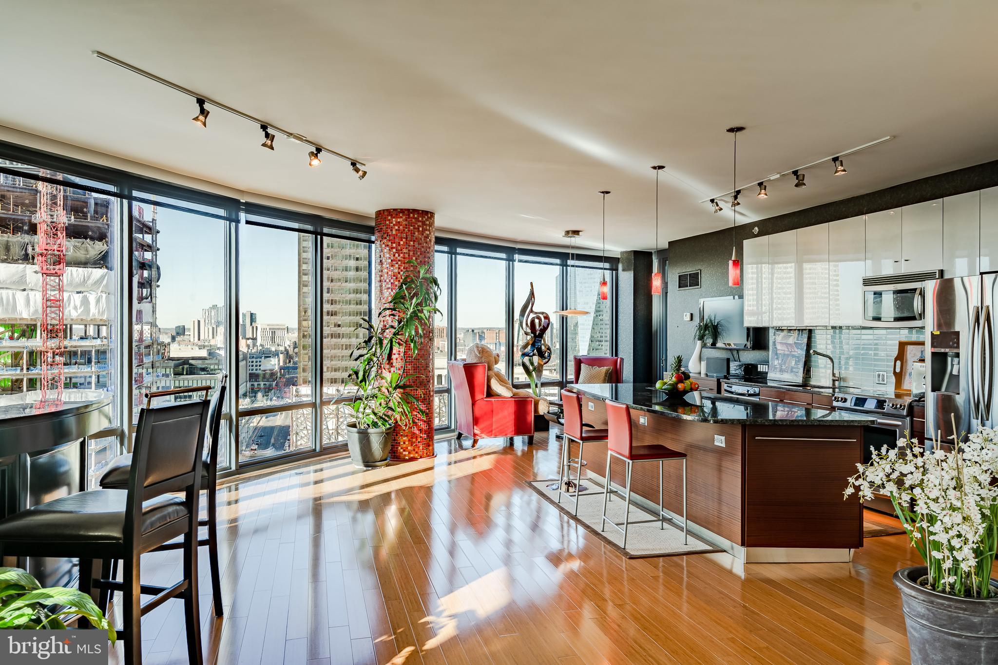 2101-00 Market Street, Unit 1803 Philadelphia, PA 19103 - Photo 11 of 52 a very nice looking living room with a large window and dining table