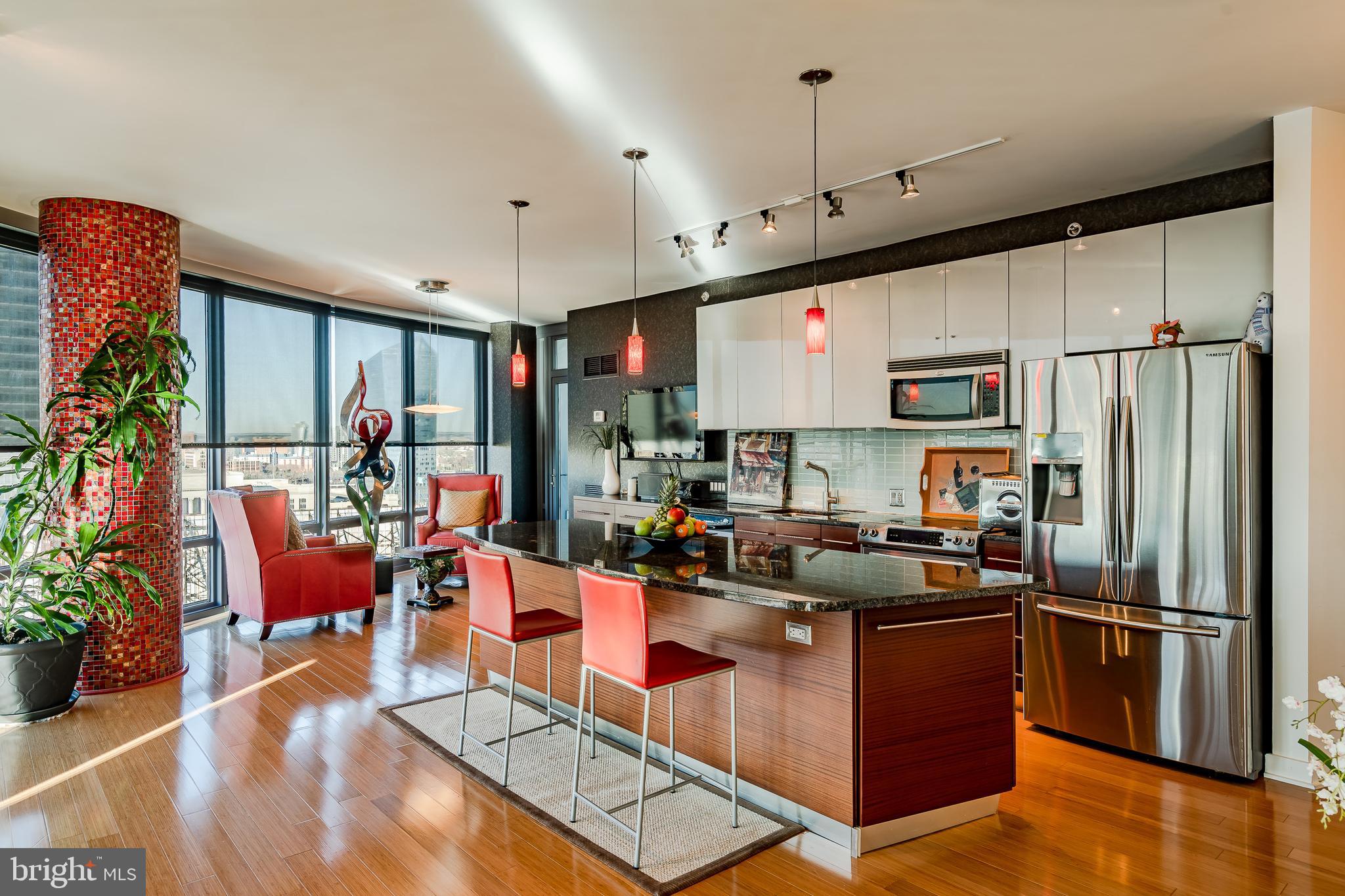 2101-00 Market Street, Unit 1803 Philadelphia, PA 19103 - Photo 13 of 52 a kitchen with stainless steel appliances granite countertop a refrigerator a stove top oven a sink dishwasher and a refrigerator