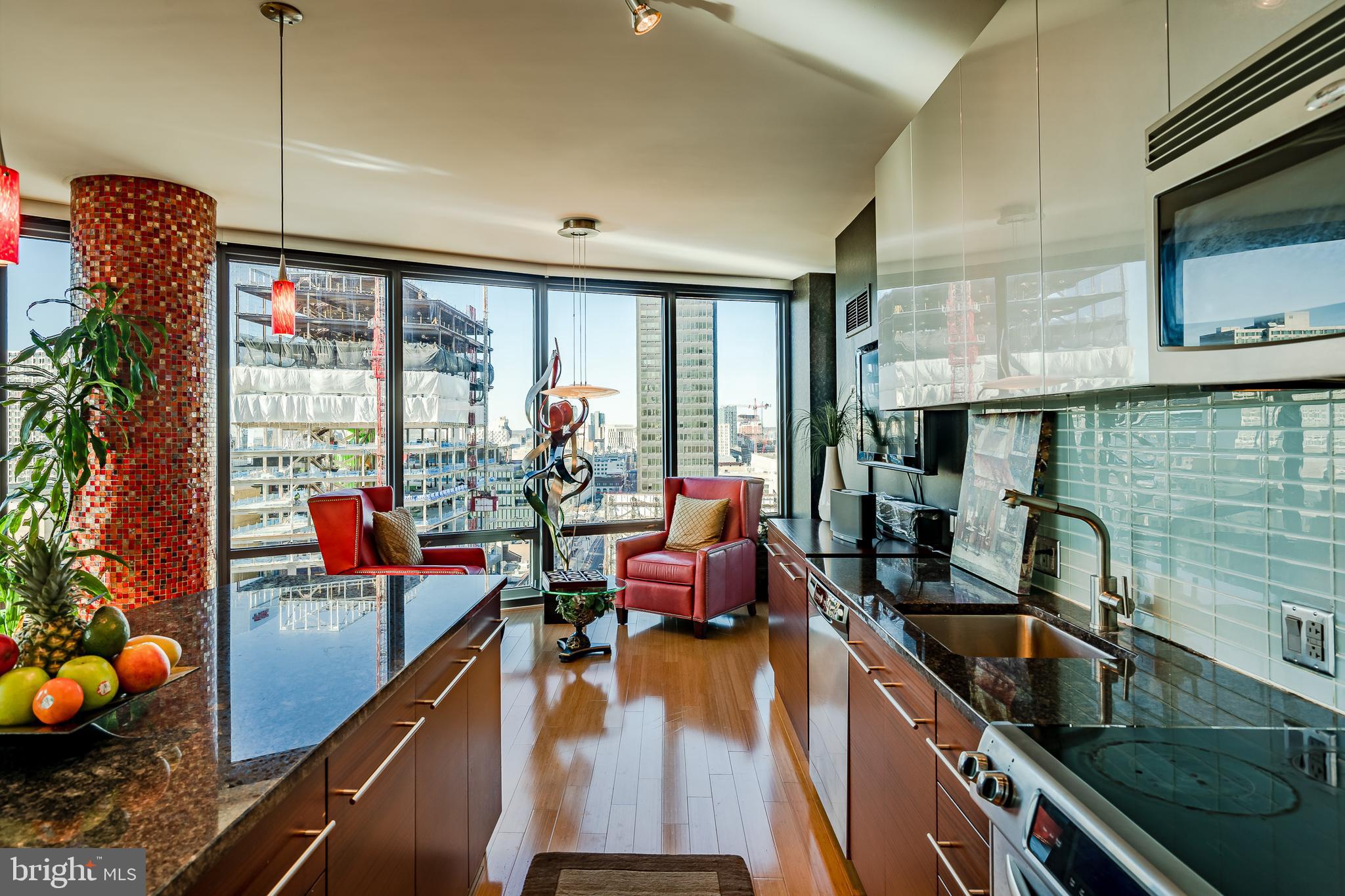 2101-00 Market Street, Unit 1803 Philadelphia, PA 19103 - Photo 15 of 52 a room with furniture and a flat screen tv