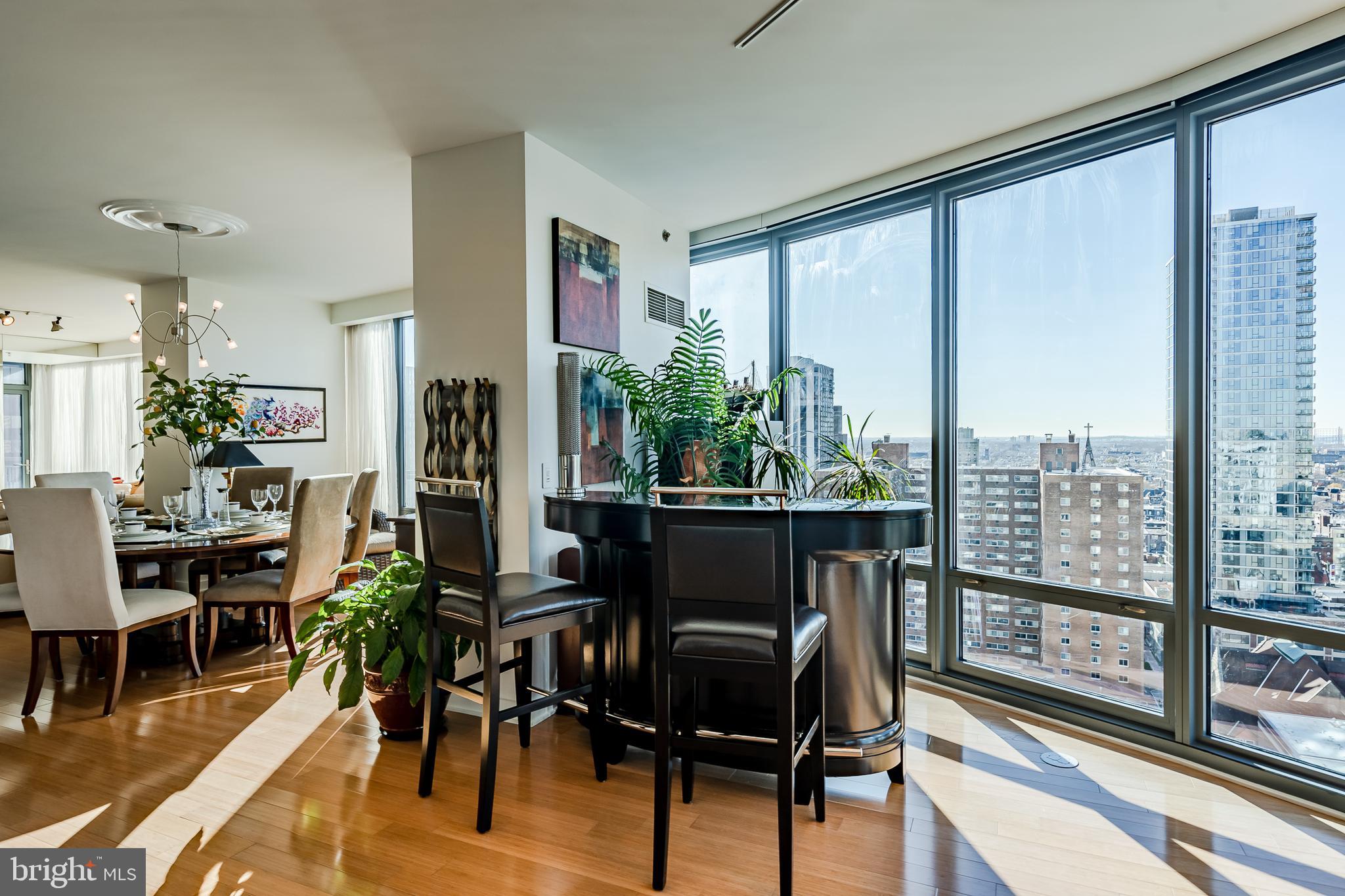 2101-00 Market Street, Unit 1803 Philadelphia, PA 19103 - Photo 19 of 52 a view of a dining room with furniture window and outside view