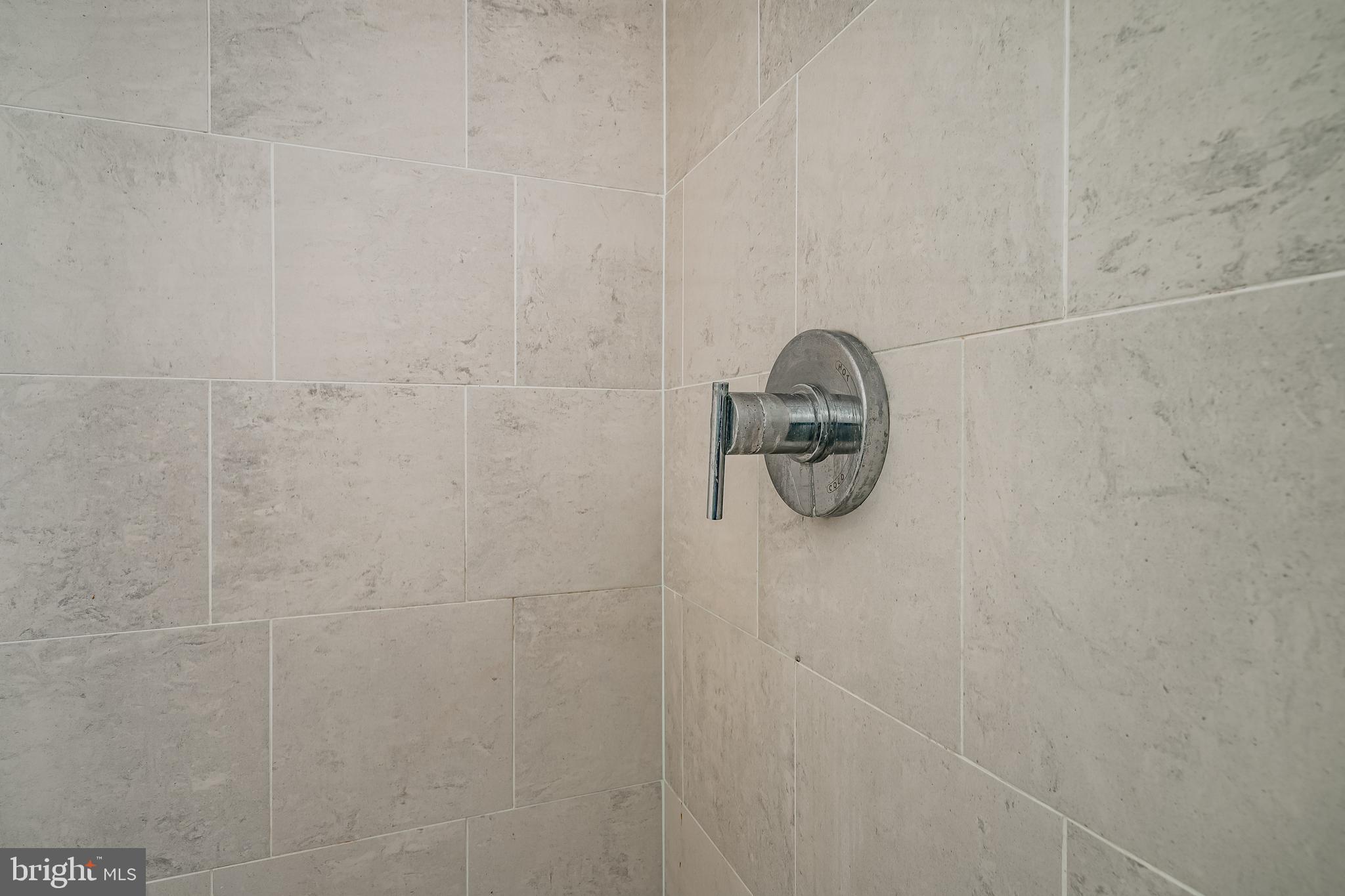 2101-00 Market Street, Unit 1803 Philadelphia, PA 19103 - Photo 24 of 52 a close view of shower