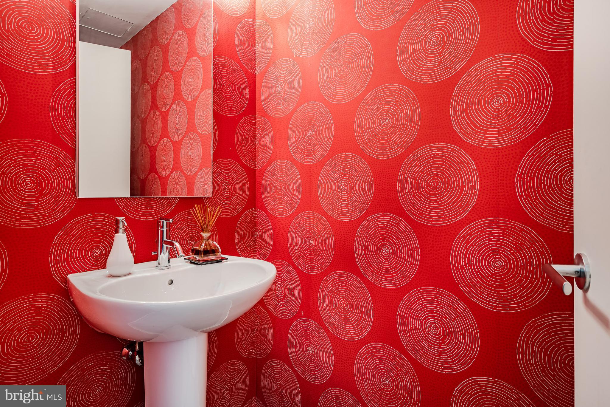 2101-00 Market Street, Unit 1803 Philadelphia, PA 19103 - Photo 25 of 52 a bathroom with a sink and a mirror