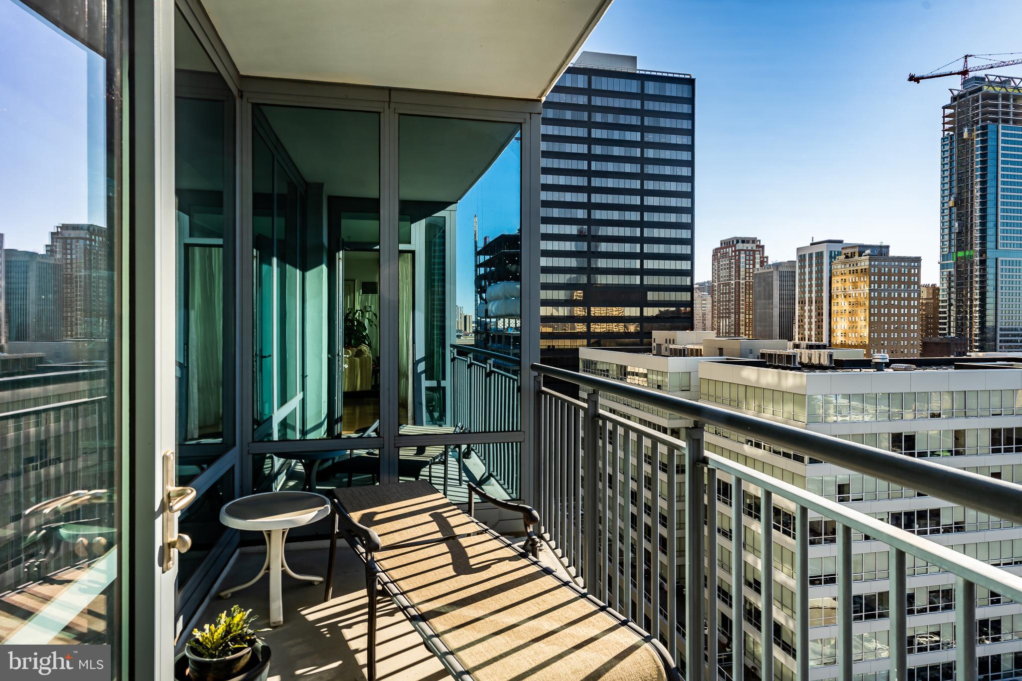 2101-00 Market Street, Unit 1803 Philadelphia, PA 19103 - Photo 26 of 52 a view of a balcony with chairs