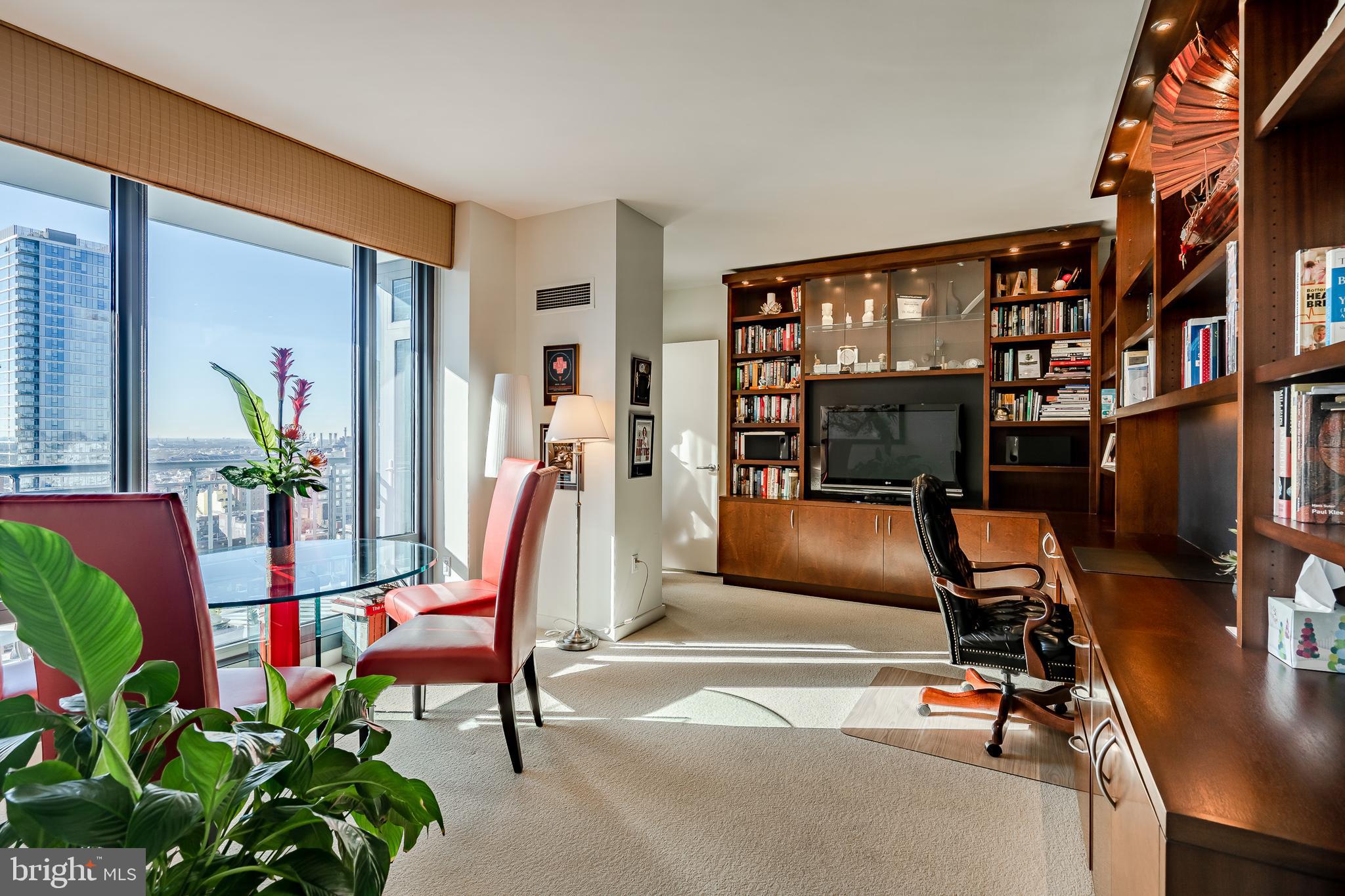 2101-00 Market Street, Unit 1803 Philadelphia, PA 19103 - Photo 29 of 52 a view of a livingroom with furniture and a gym