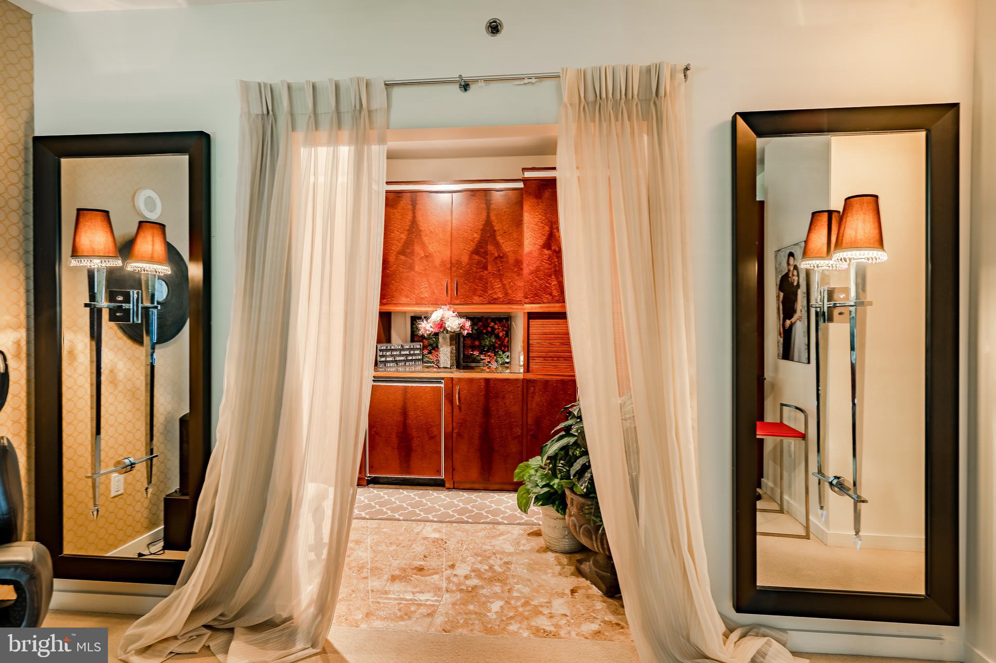 2101-00 Market Street, Unit 1803 Philadelphia, PA 19103 - Photo 33 of 52 a view of a hallway with wooden floor and windows