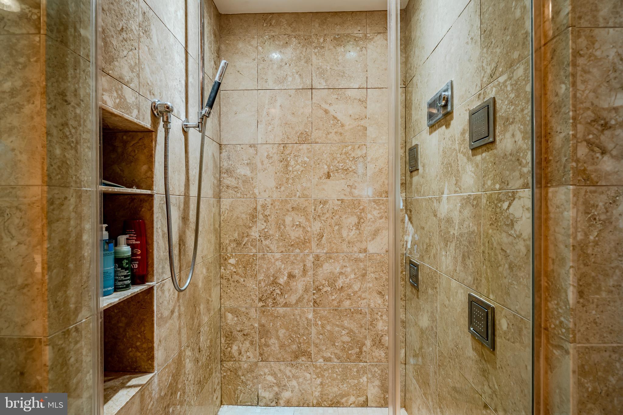 2101-00 Market Street, Unit 1803 Philadelphia, PA 19103 - Photo 40 of 52 a bathroom with a shower