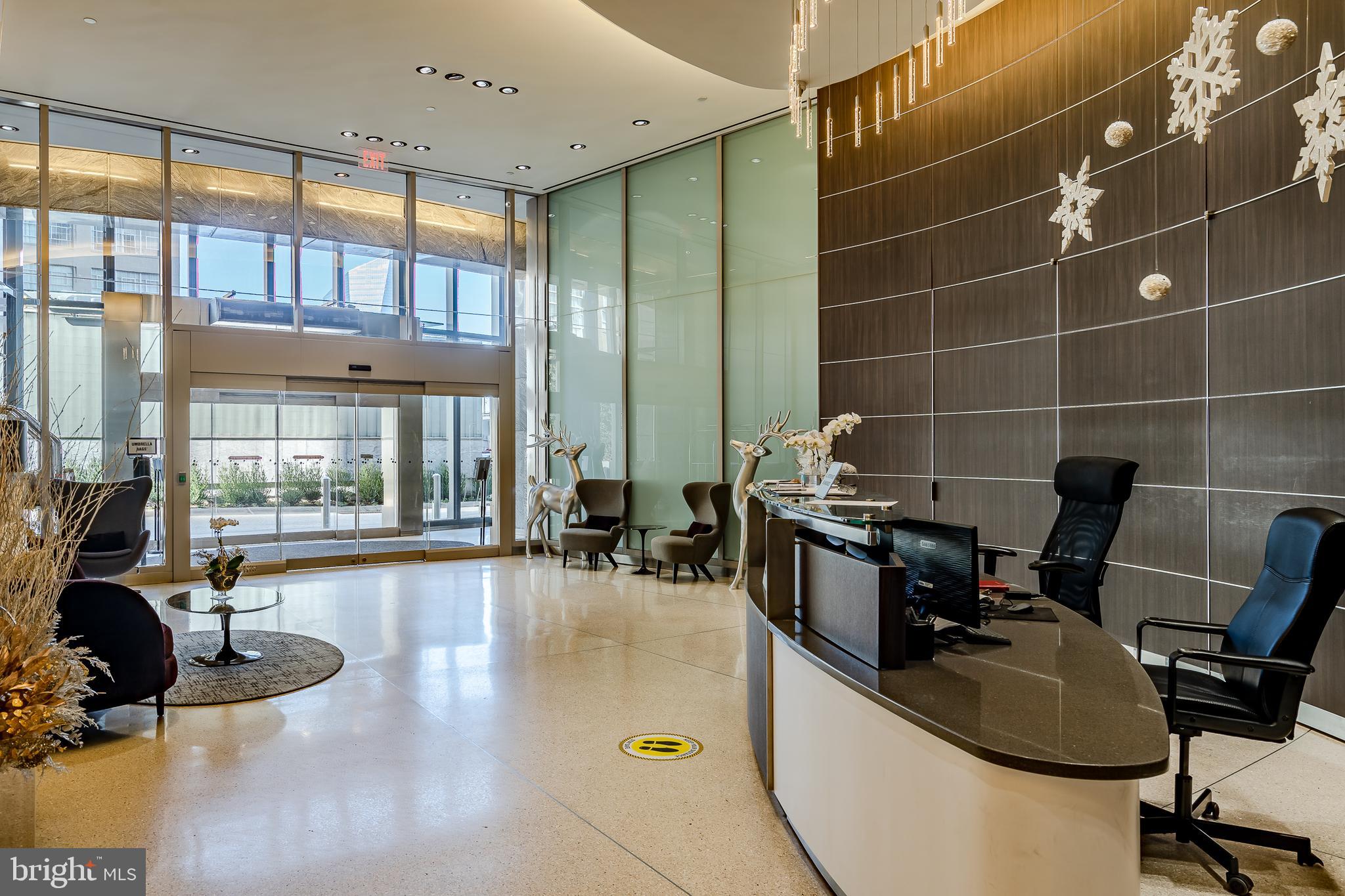 2101-00 Market Street, Unit 1803 Philadelphia, PA 19103 - Photo 4 of 52 a gym area with gym equipment and a large window