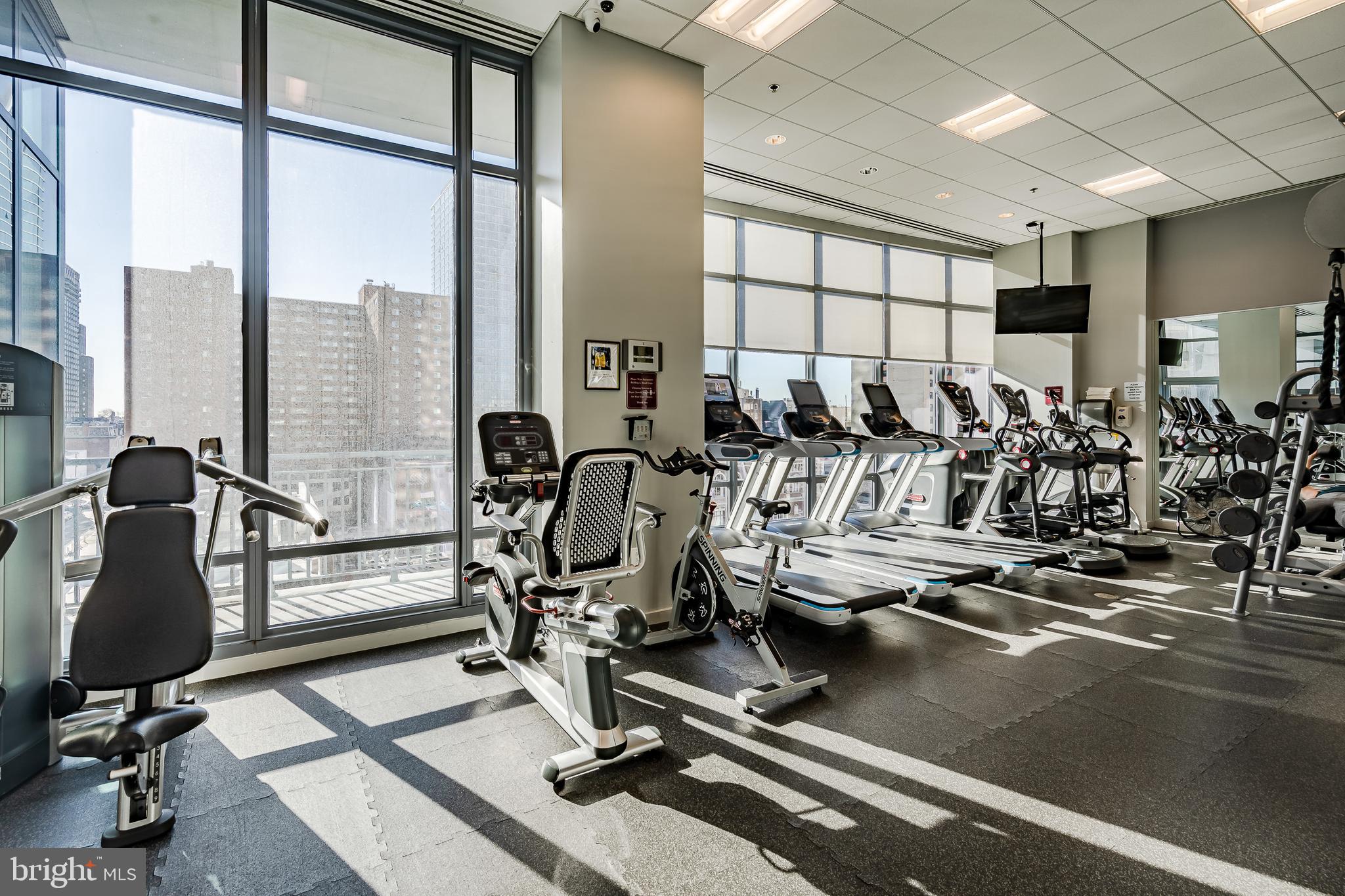 2101-00 Market Street, Unit 1803 Philadelphia, PA 19103 - Photo 43 of 52 a view of a room with gym equipment