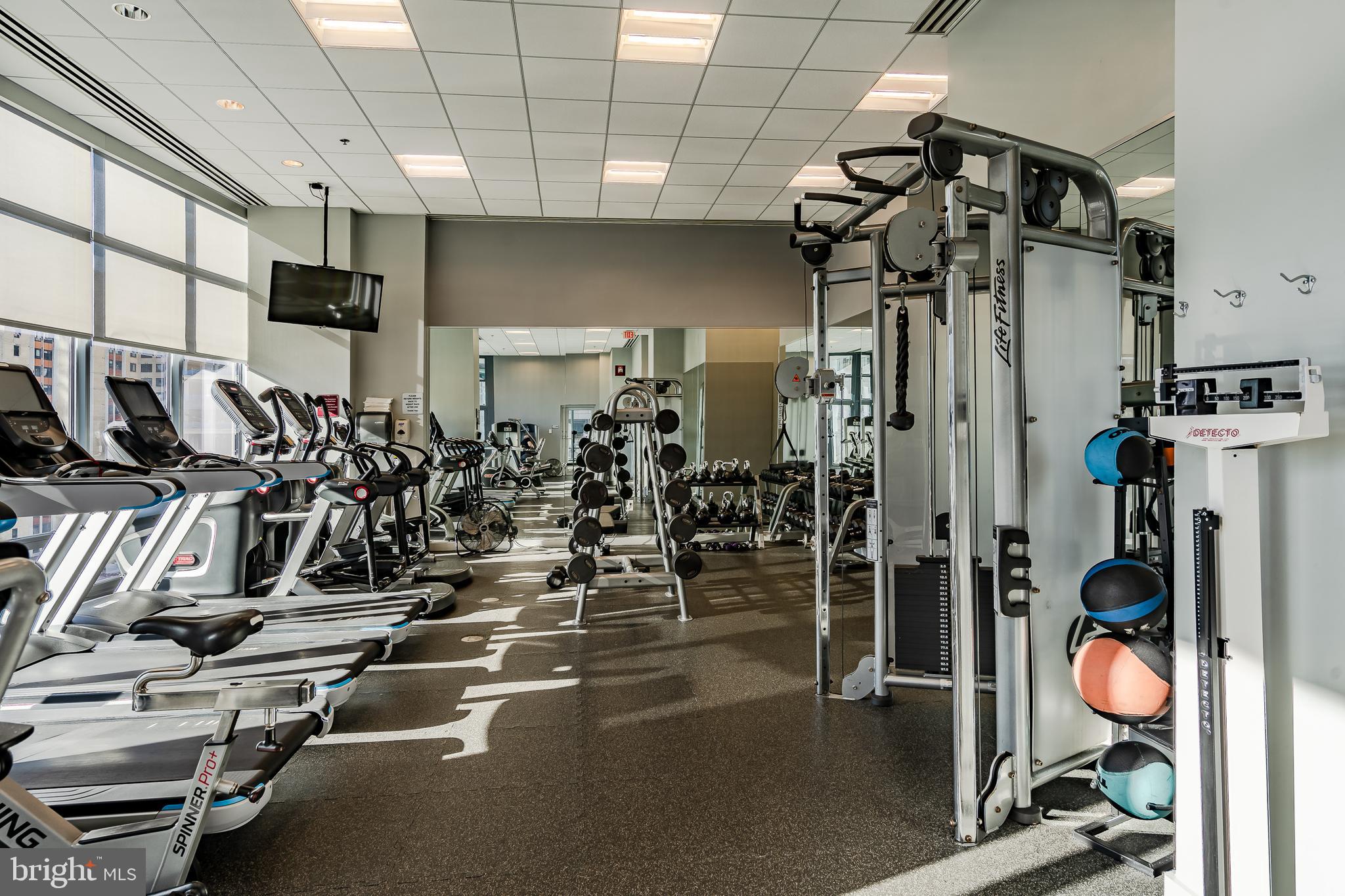2101-00 Market Street, Unit 1803 Philadelphia, PA 19103 - Photo 44 of 52 a view of a room with gym equipment
