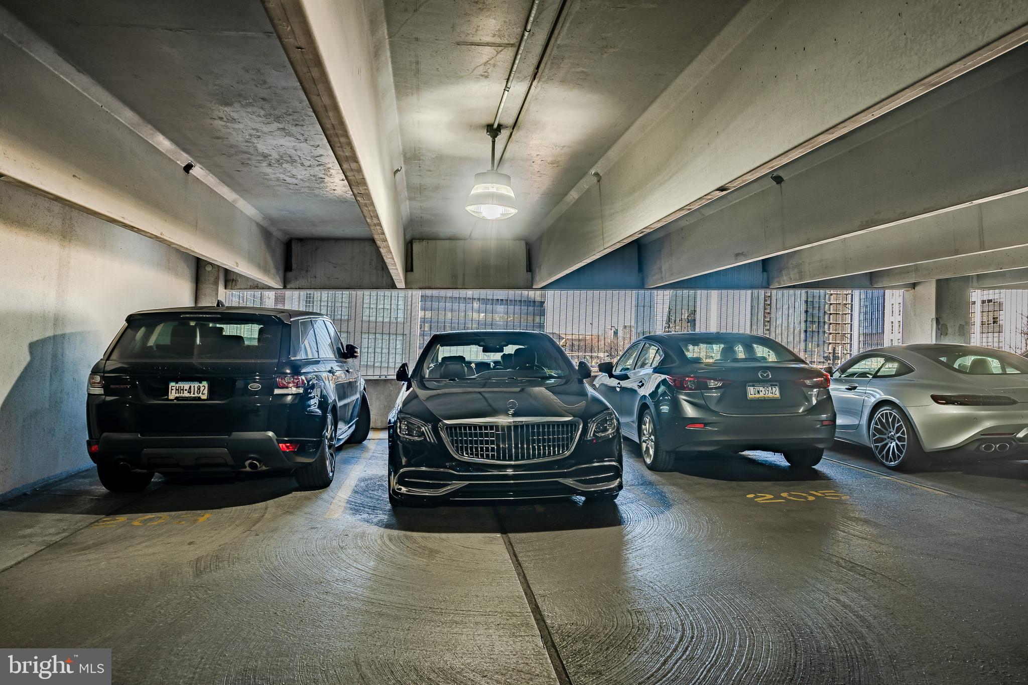 2101-00 Market Street, Unit 1803 Philadelphia, PA 19103 - Photo 49 of 52 a view of parking garage with cars parked