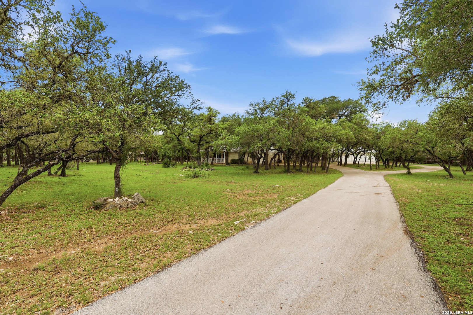 261 Fawn Lane Spring Branch, TX 78070 - Photo 6 of 44 a swimming pool with outdoor seating and garden