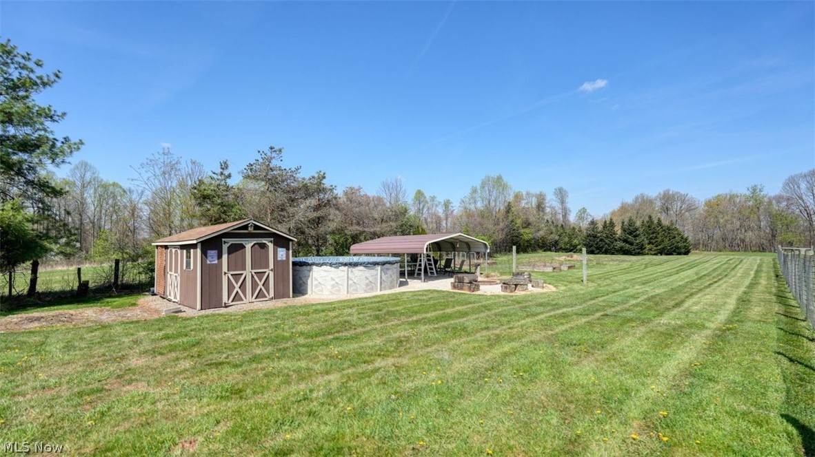 63155 Arrowhead Road Cambridge, OH 43725 - Photo 40 of 50 View of yard featuring a rural view and a shed