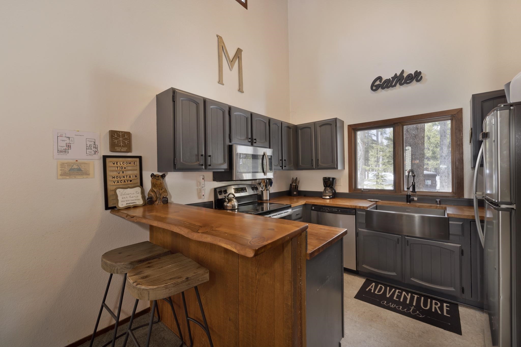 3005 Meridian Boulevard, Unit 47 Mammoth Lakes, CA 93546 - Photo 11 of 40 a kitchen that has a sink cabinets counter space and appliances